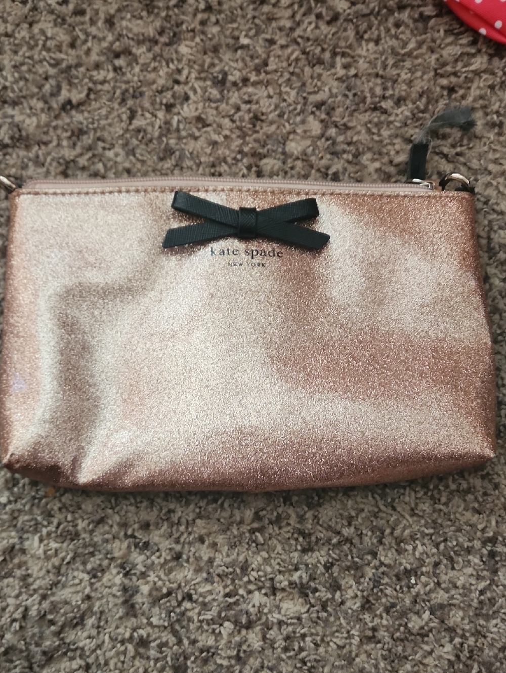kate spade Rose Gold Glitter Cosmetic Pouch with Black Bow